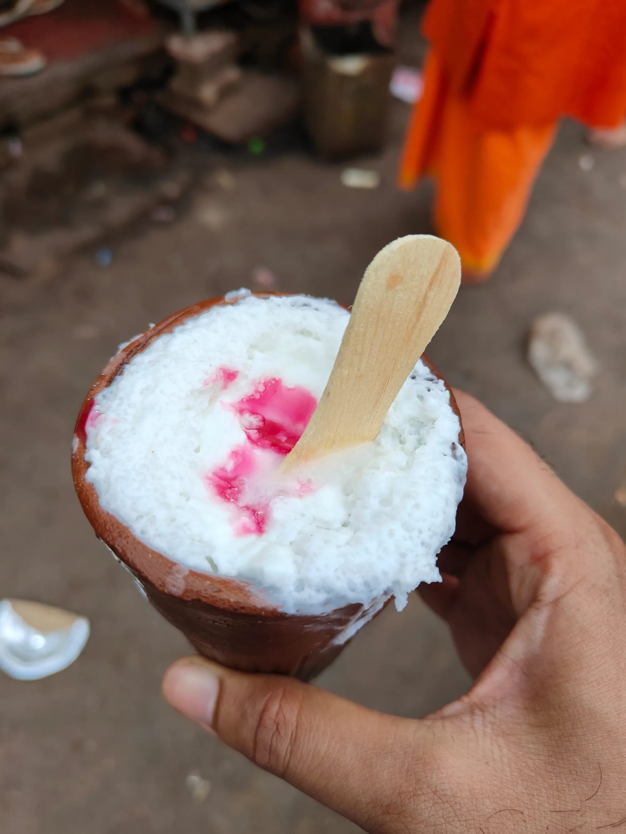 Kulhad lassi with a swirl of rose