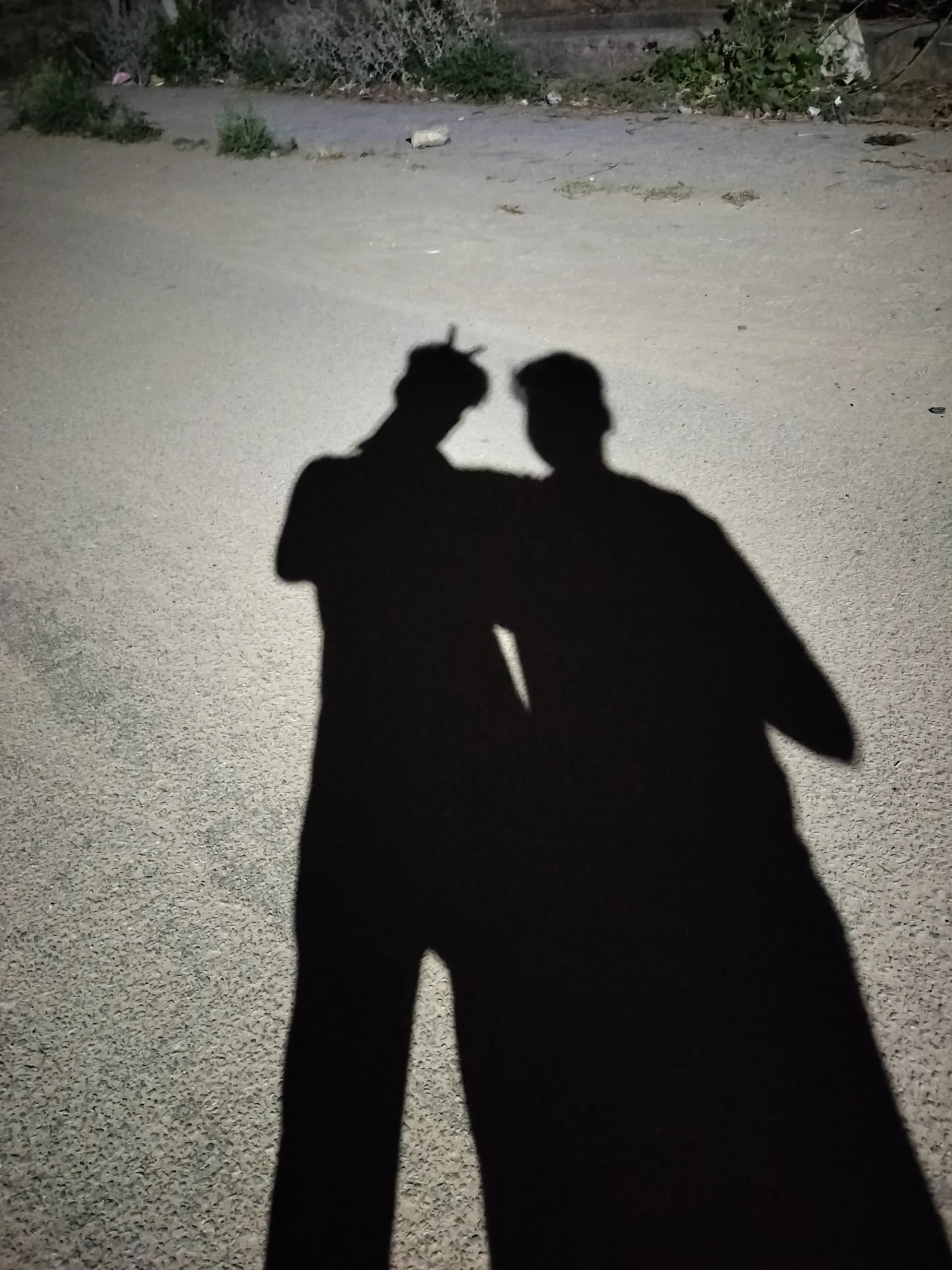 Shadow silhouettes of friends at night