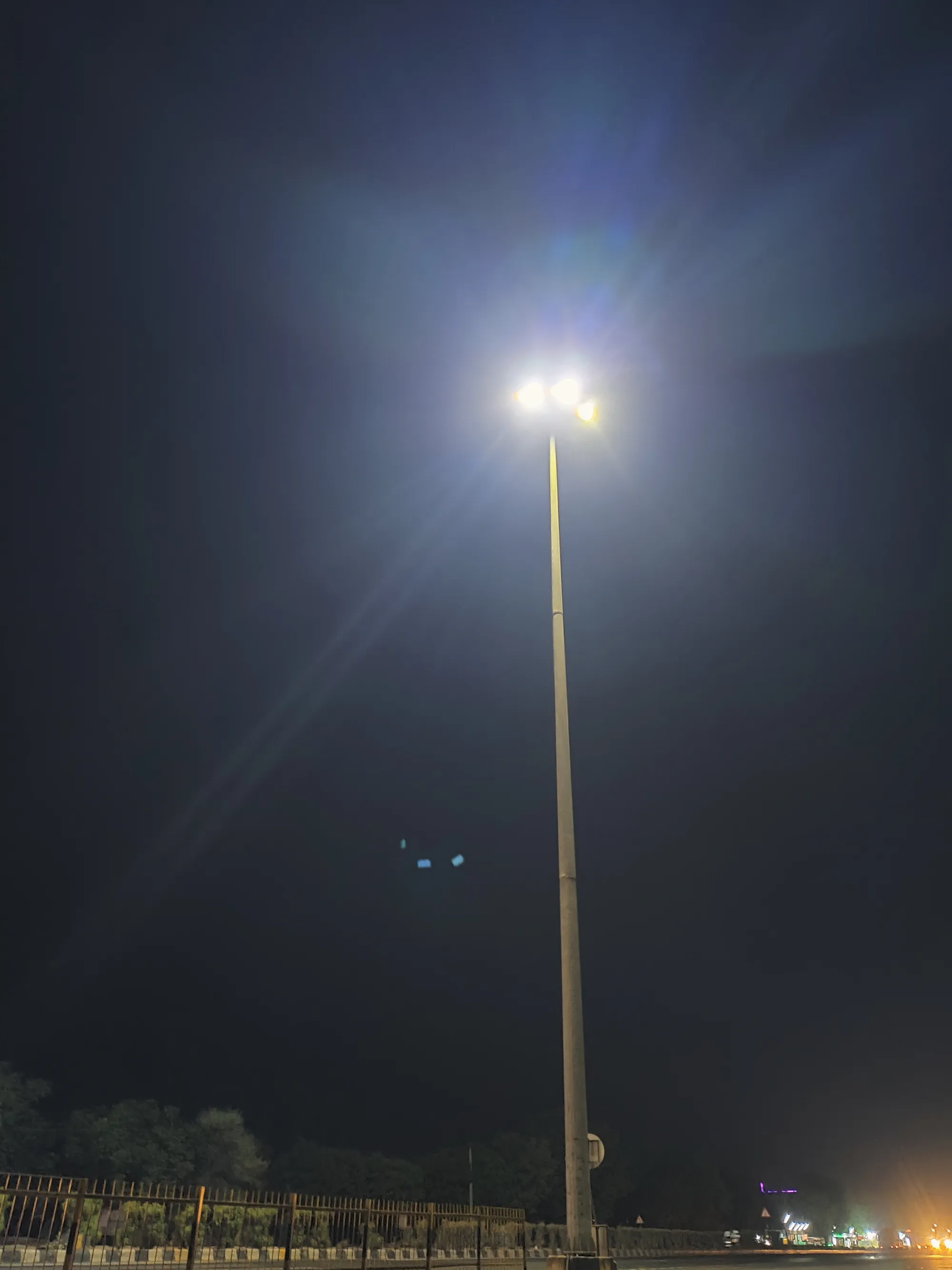 Street lamp glowing against the night